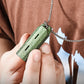 Outdoor titanium alloy whistle EDC high decibel burst whistle